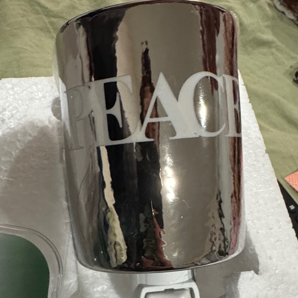 Joy Mangano Silver Peace Holiday wax melt plug in